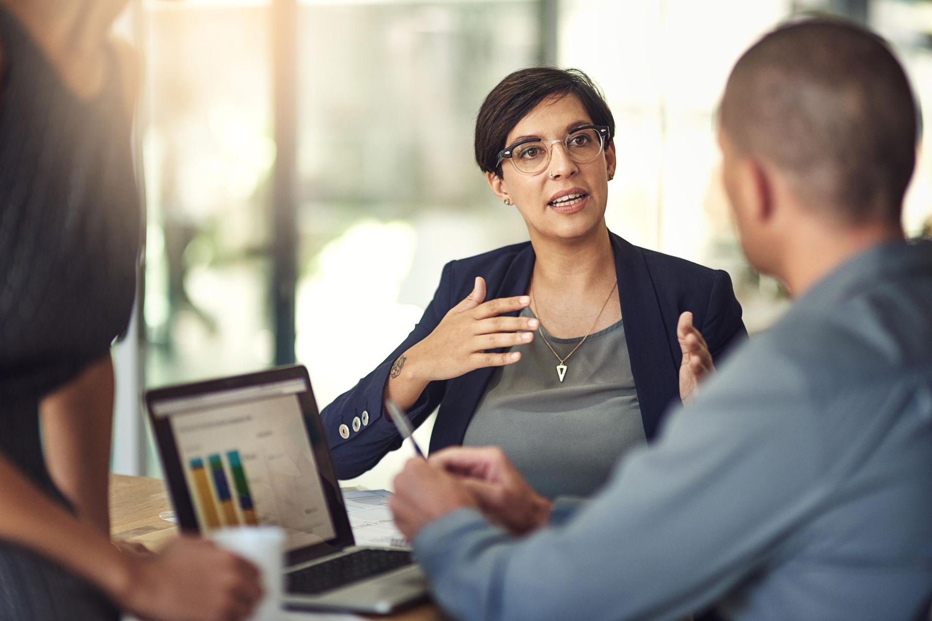 A female executive talking to her board of directors Unified Enterprise System